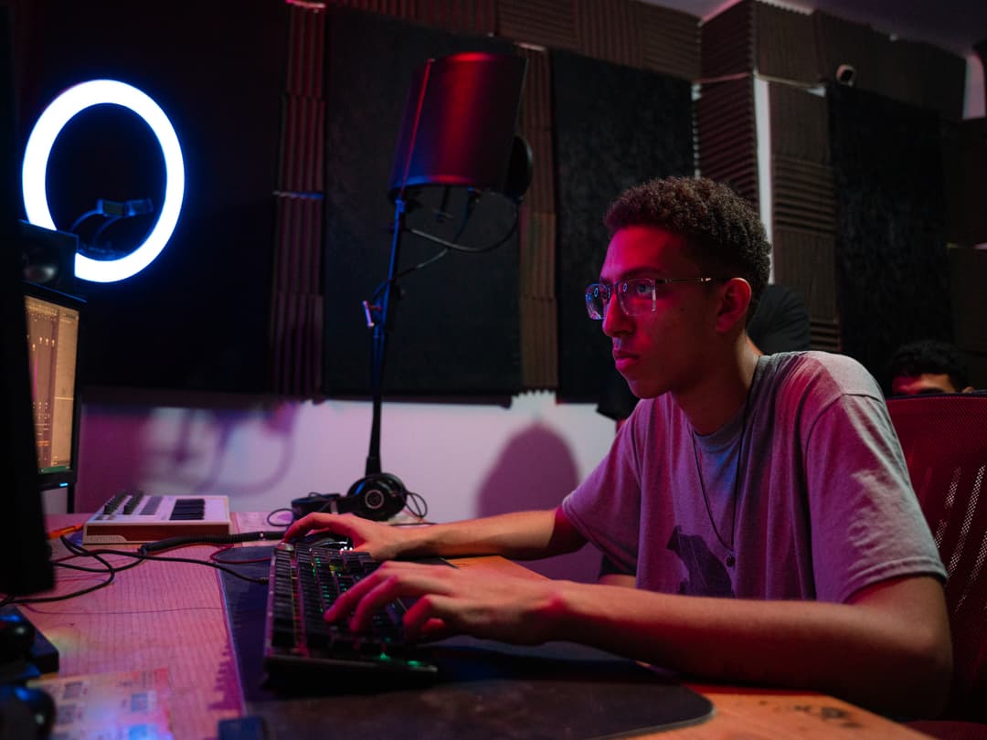 AhmedyTheGr8 mixing audio on the console at GR8NIK STUDIOS